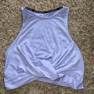 Ryderwear lavender workout tank top, never worn size small, cross cross front